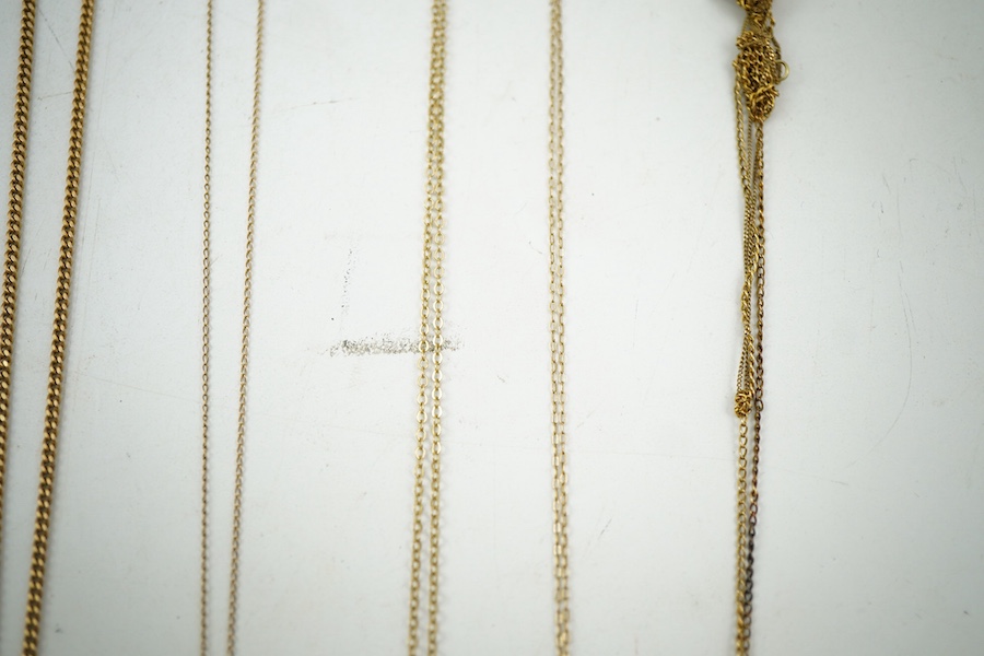 A collection of jewels, comprising: two cross pendants; a heart-shaped locket pendant; a circular locket pendant engraved with a sunflower; a pendant set with a sapphire; a diamond panel brooch; and a sapphire and diamon